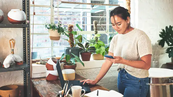 Small business owner viewing her COI on a phone