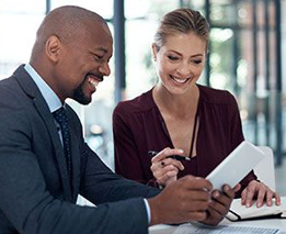 Business partners looking at a phone